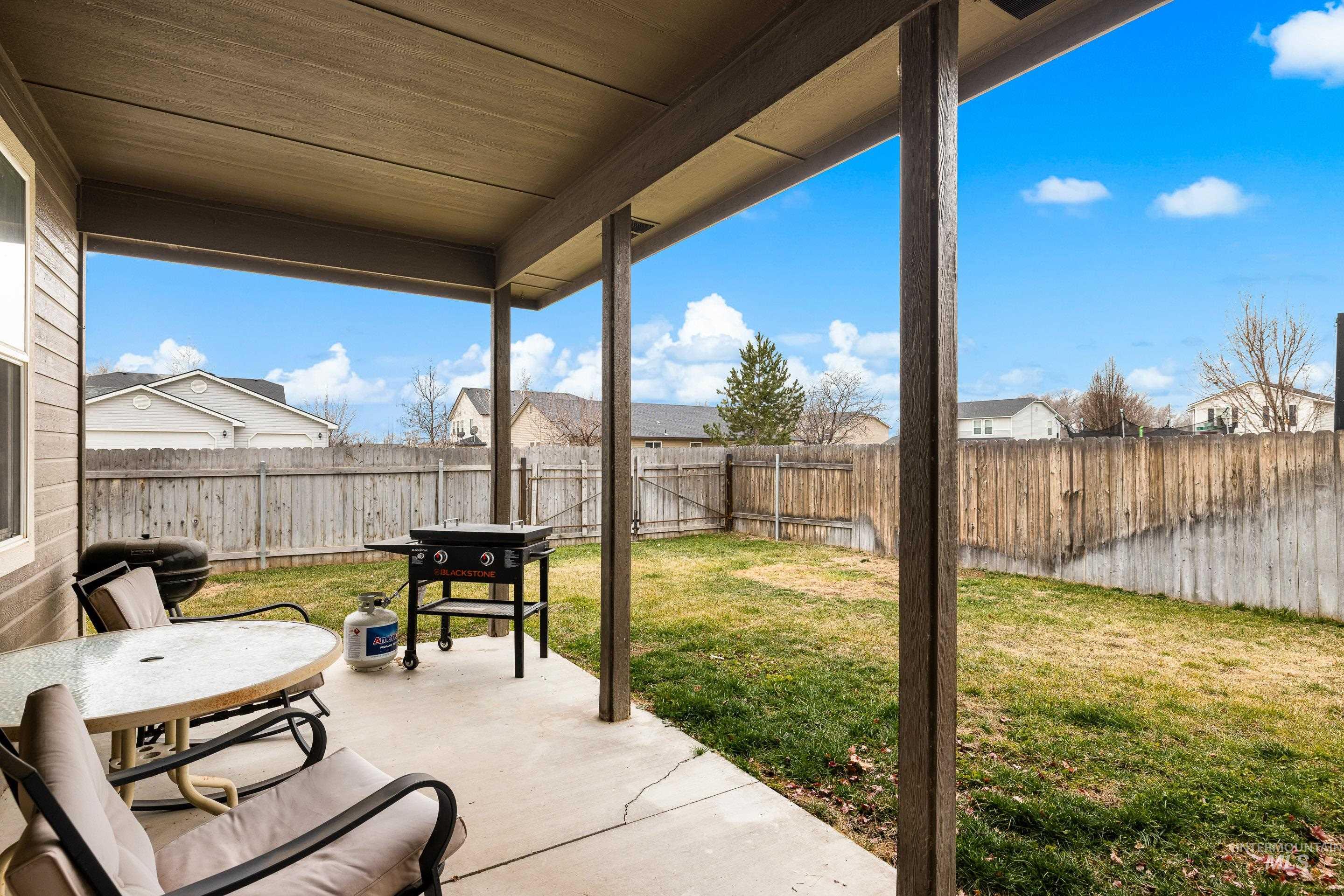 191 Southwest Quaker Drive Mountain Home, ID 83647 - Photo 40 of 43 Fenced backyard featuring a patio