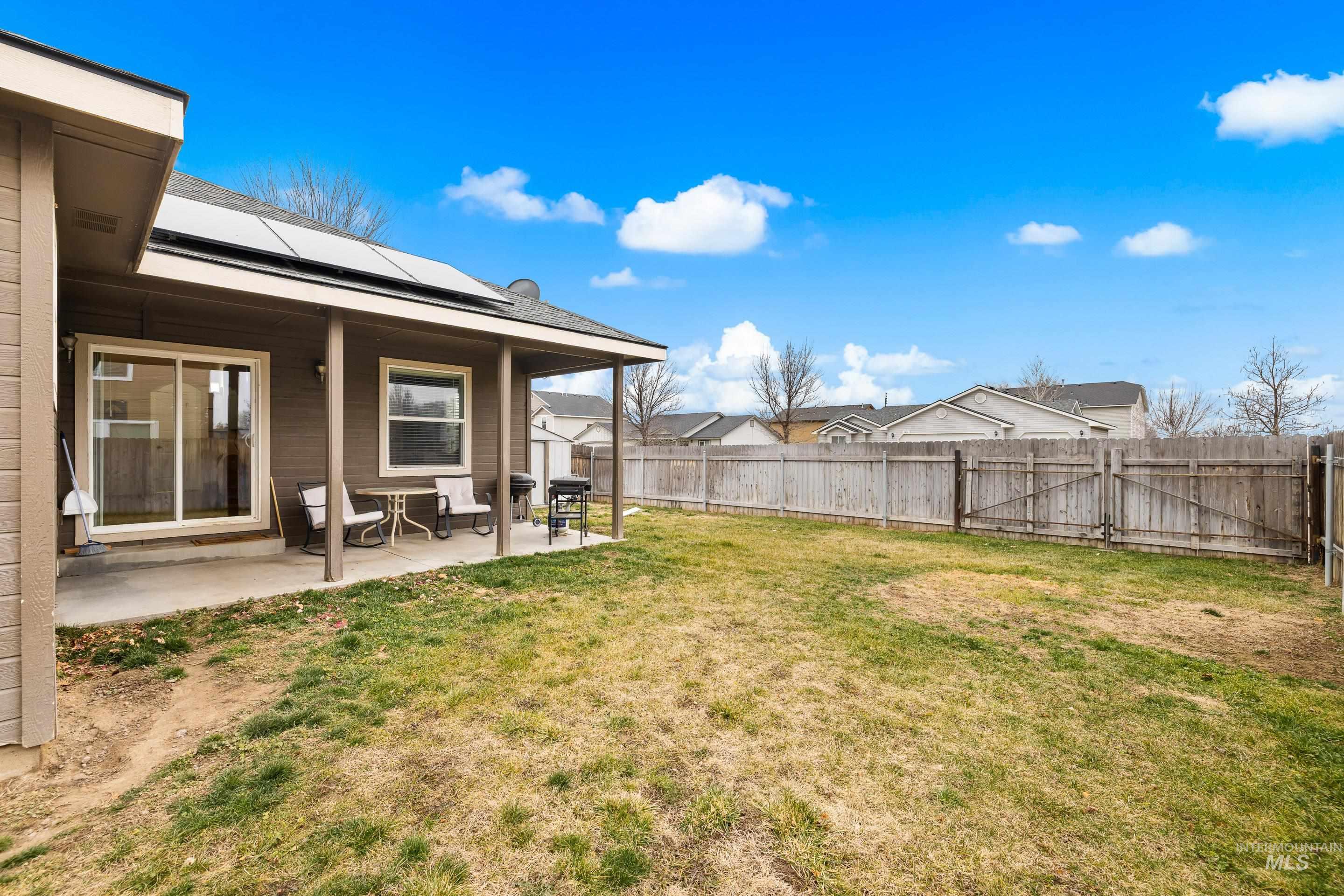 191 Southwest Quaker Drive Mountain Home, ID 83647 - Photo 41 of 43 Fenced backyard with a patio