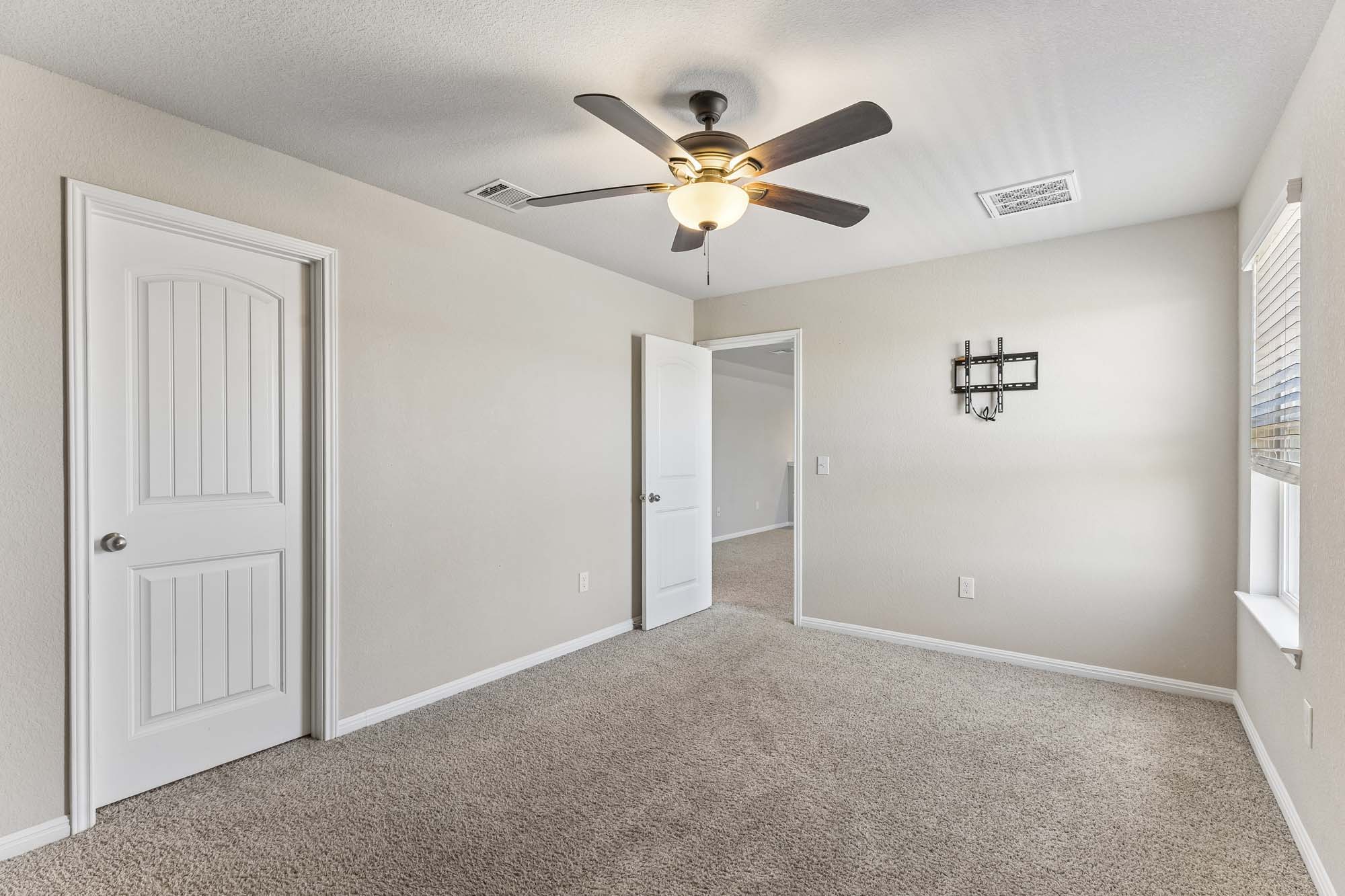 124 Moravia Road Georgetown, TX 78626 - Photo 21 of 38 Plush carpeting and natural light define this versatile, comfortable secondary bedroom space.