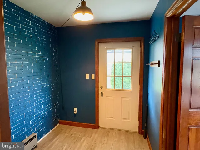 a view of entryway with wooden floor