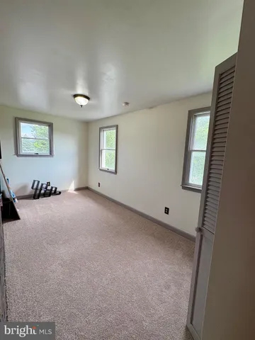 a view of a livingroom with furniture and windows