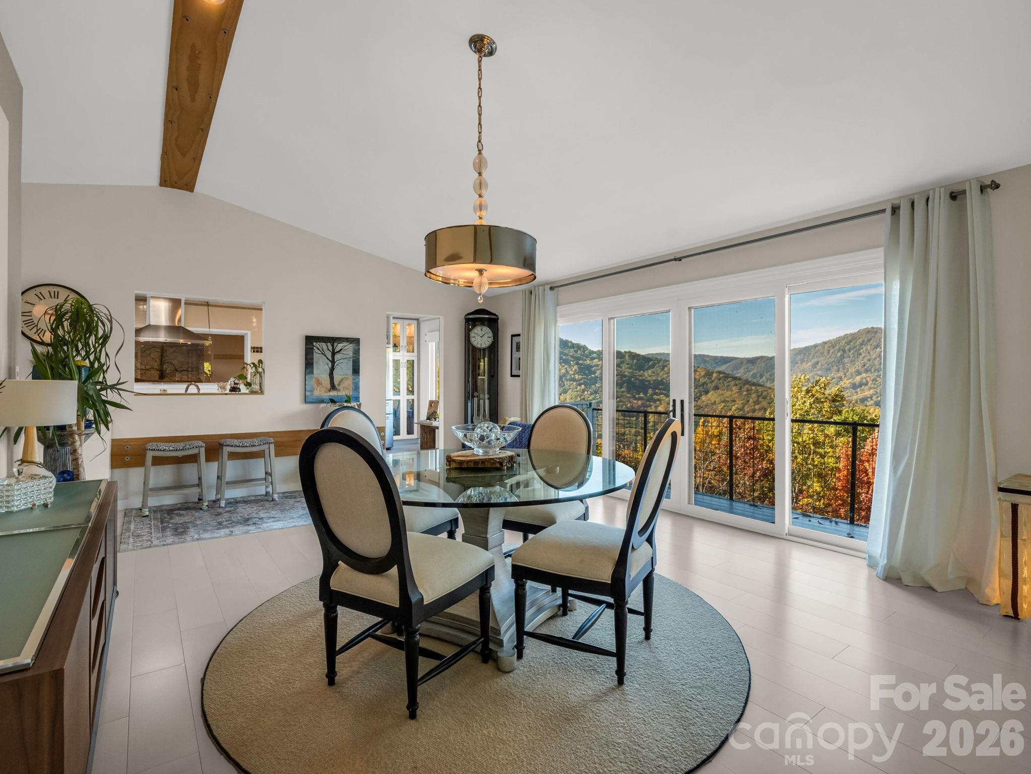 200 Piney Mountain Road Tryon, NC 28782 - Photo 2 of 48 a dining room with furniture a chandelier and wooden floor
