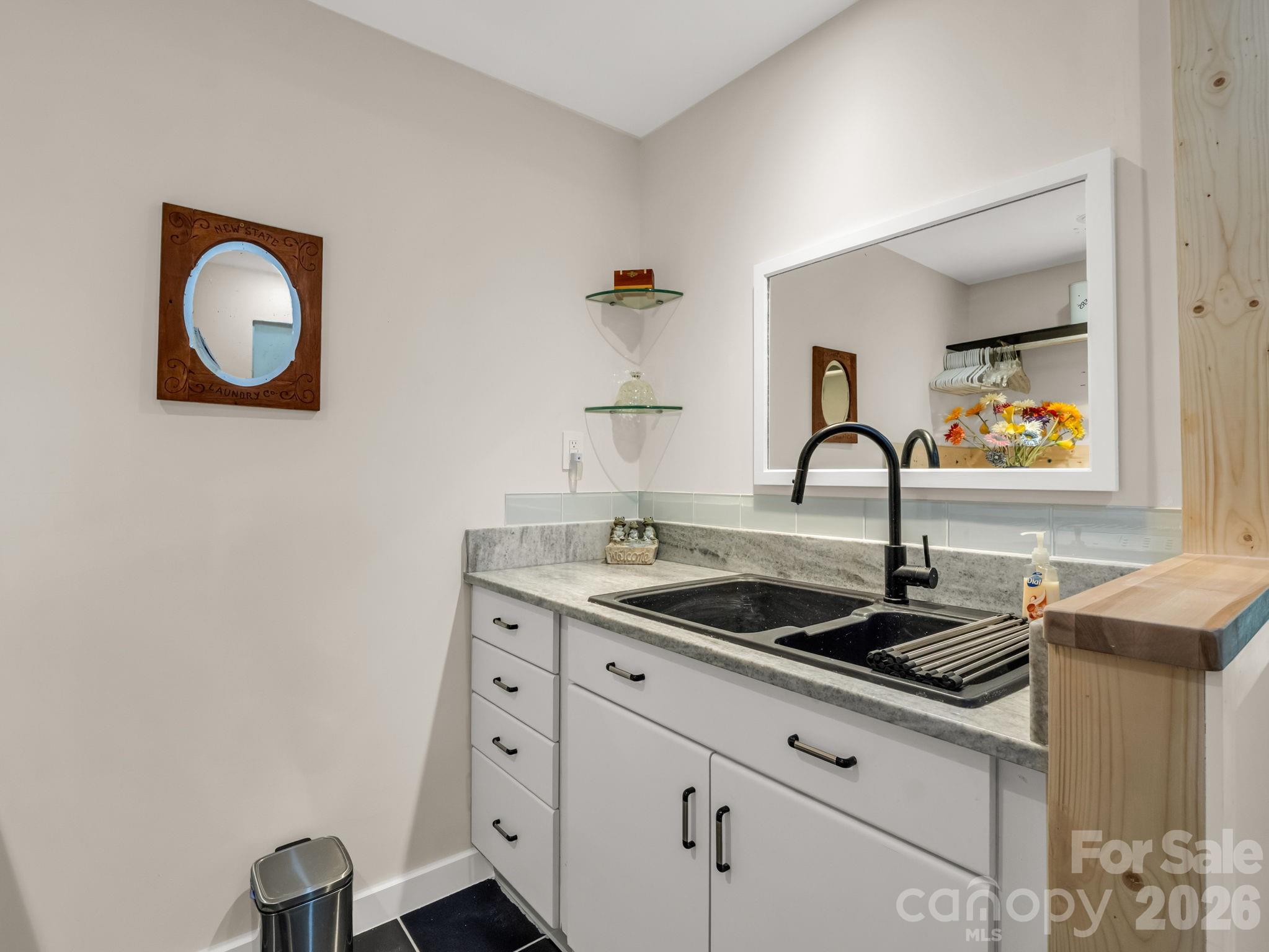 200 Piney Mountain Road Tryon, NC 28782 - Photo 21 of 48 a kitchen with granite countertop a sink and cabinets