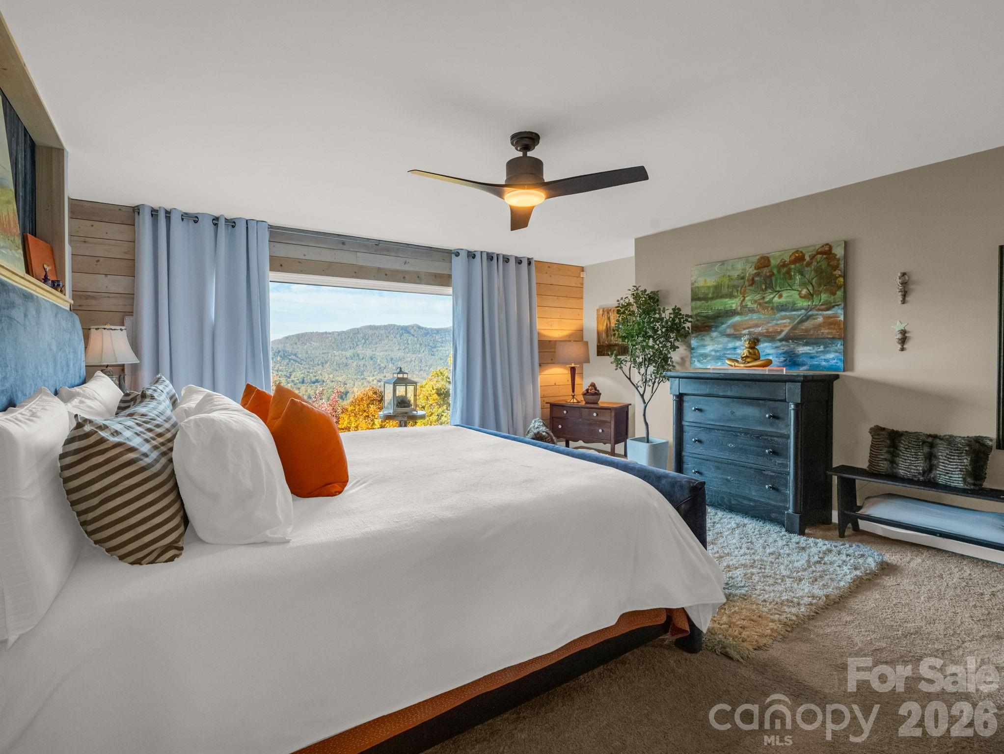 200 Piney Mountain Road Tryon, NC 28782 - Photo 24 of 48 a bedroom with a large bed and a flat tv screen