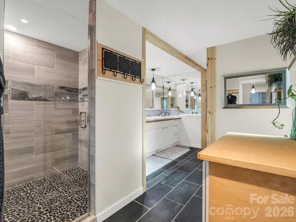 a kitchen with a refrigerator and a sink