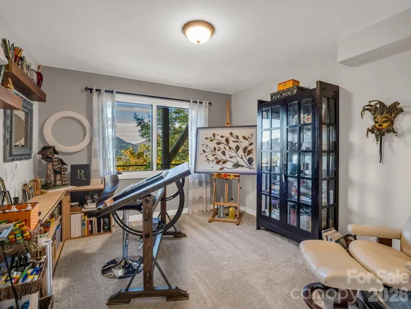 a view of a livingroom with furniture and hardwood floor