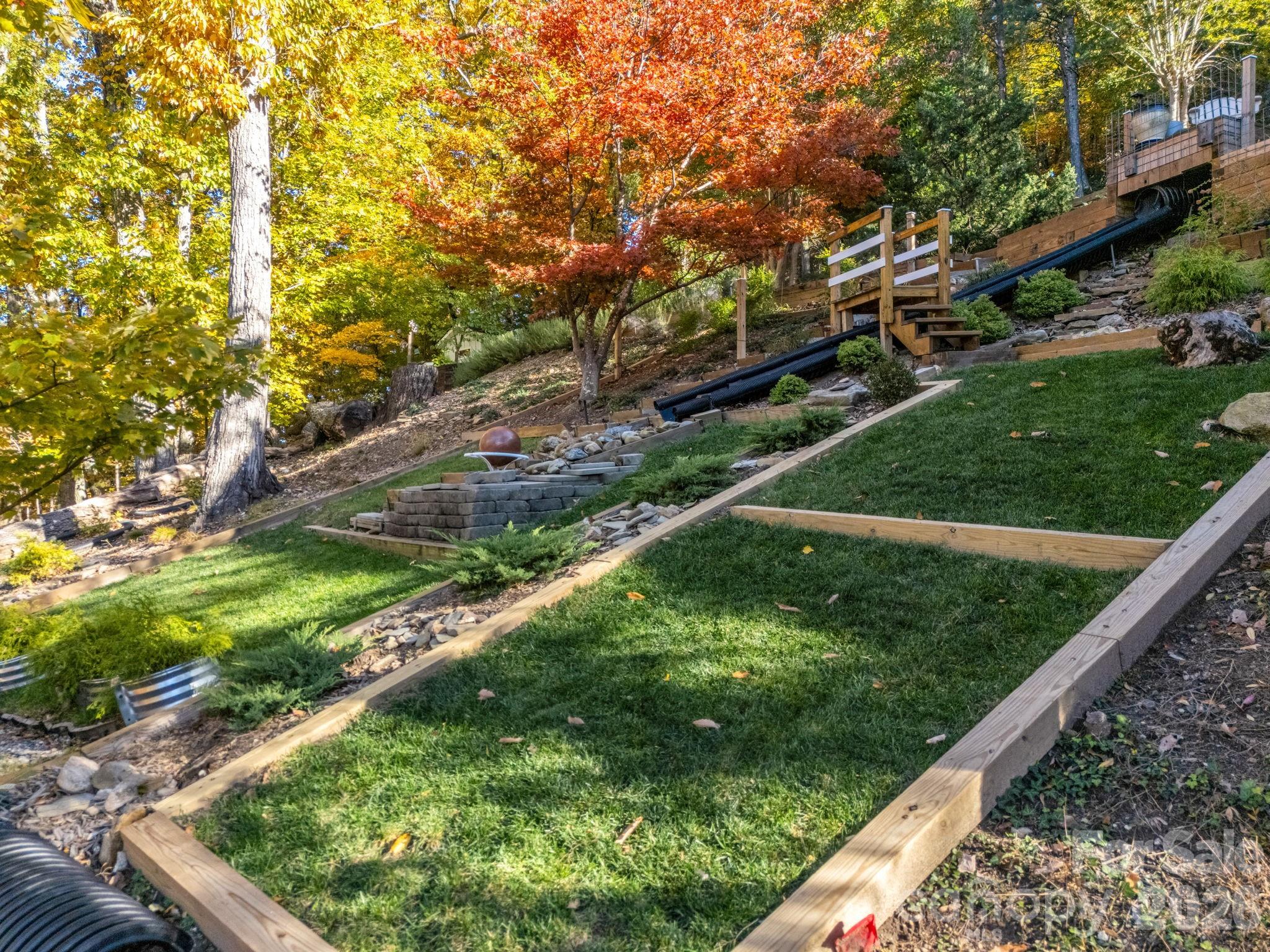 200 Piney Mountain Road Tryon, NC 28782 - Photo 40 of 48 a view of a garden from a balcony