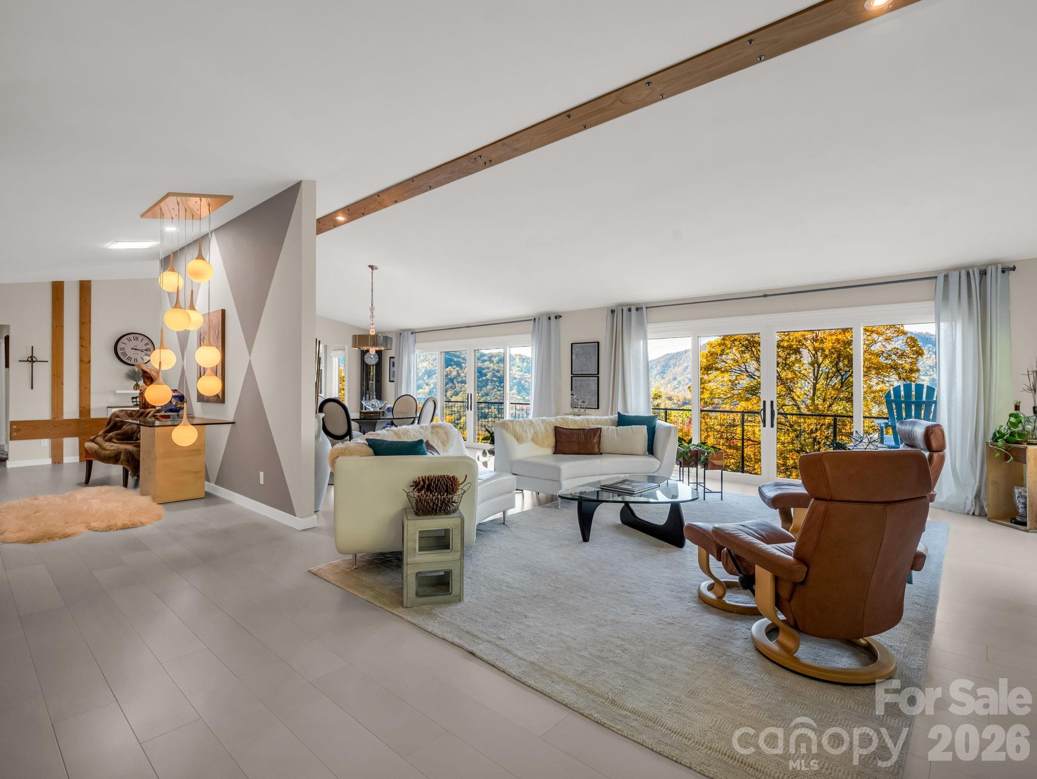 200 Piney Mountain Road Tryon, NC 28782 - Photo 4 of 48 a living room with furniture and large windows