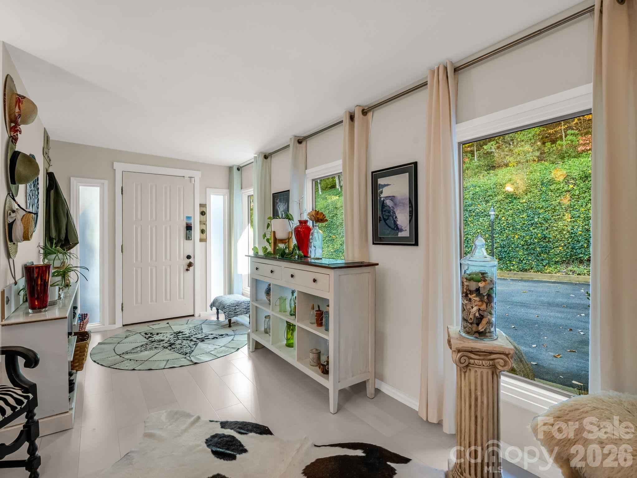 200 Piney Mountain Road Tryon, NC 28782 - Photo 7 of 48 a living room with furniture and a flat screen tv