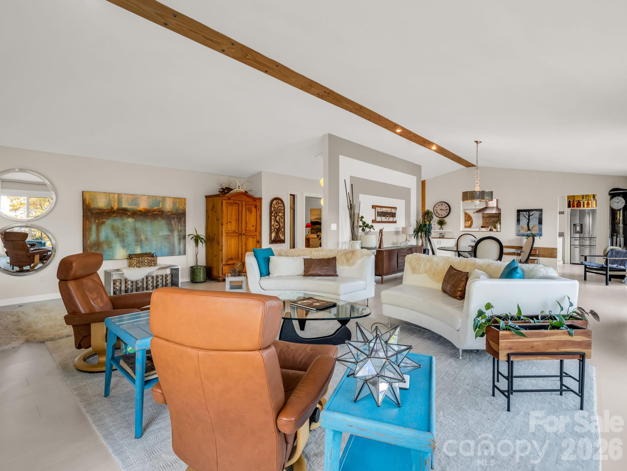 200 Piney Mountain Road Tryon, NC 28782 - Photo 10 of 48 a living room with furniture a fireplace and large windows