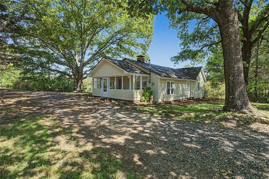 1055 Millertown Road Temple, GA 30179 - Photo 4 of 48 a front view of a house with a garden