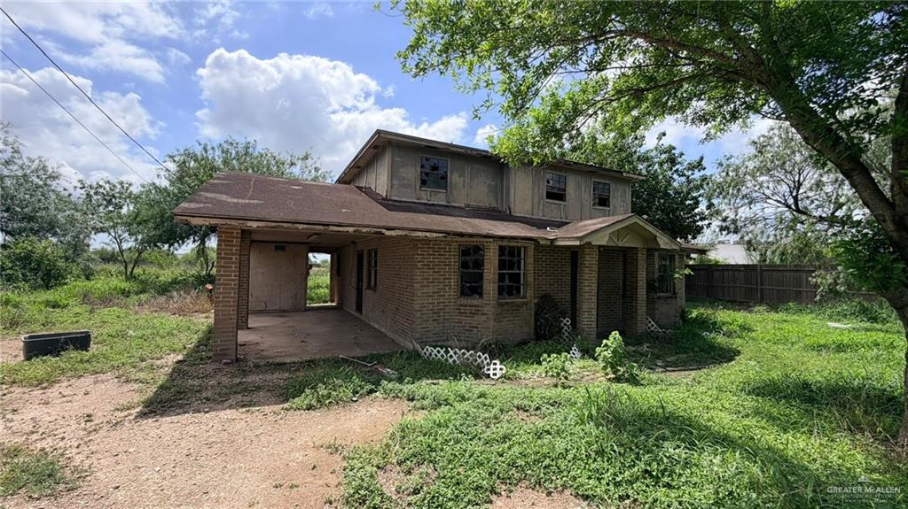 1524 West Hi Line Road Pharr, TX 78577 - Photo 5 of 34 a front view of a house with garden
