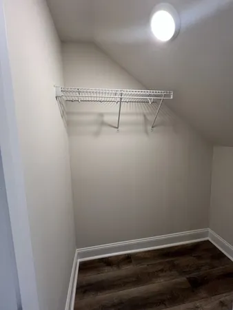 a view of a room with racks on the wall