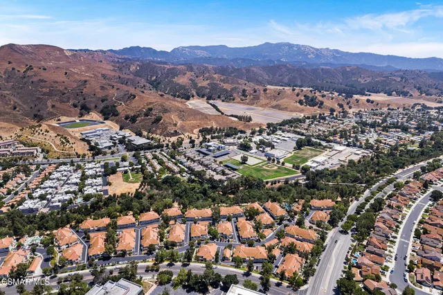 an aerial view of residential house and green space
