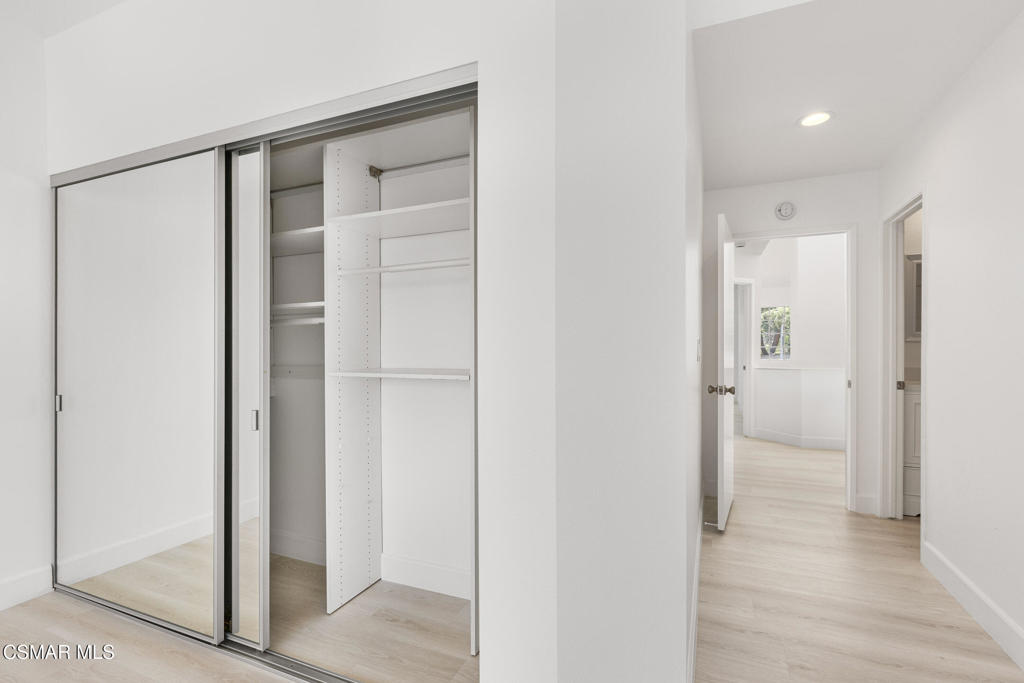 4240 Lost Hills Road, Unit 802 Calabasas, CA 91301 - Photo 34 of 49 a view of an empty room with wooden floor and a bathroom