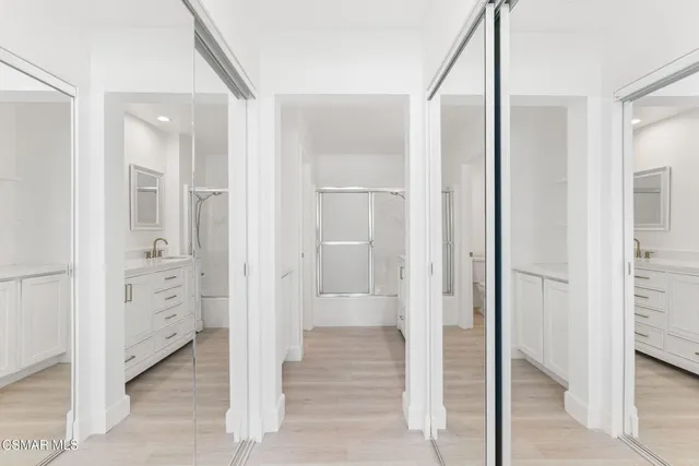 a bathroom with a sink and shower