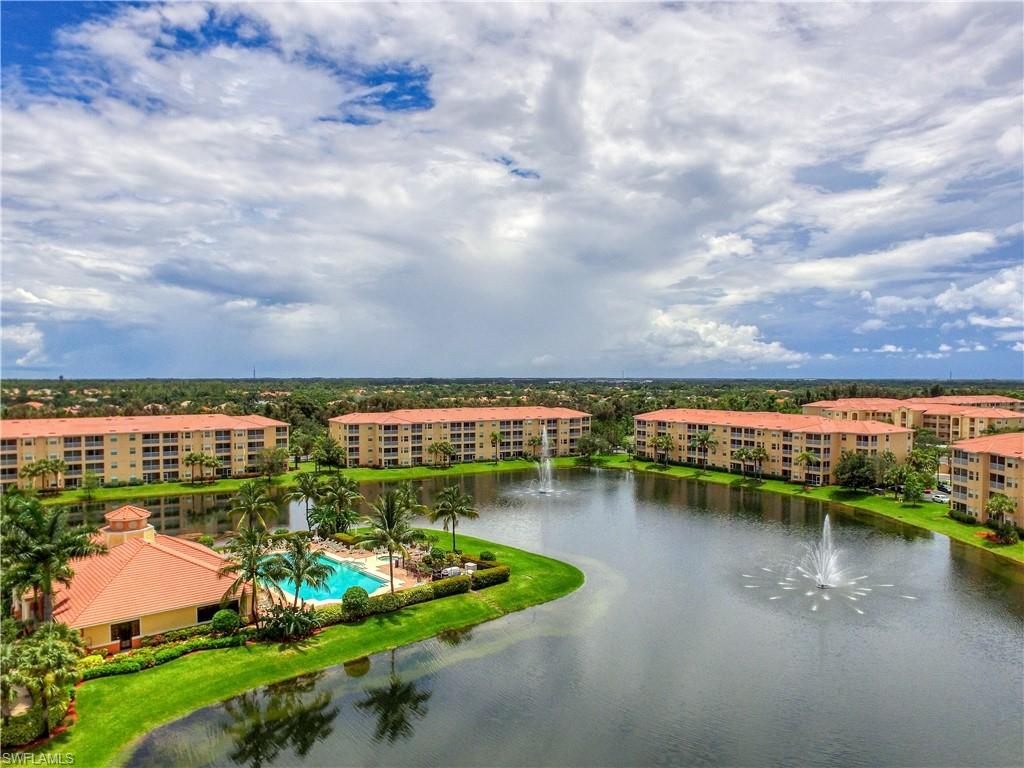 8490 Kingbird Loop, Unit 934 Estero, FL 33967 - Photo 1 of 26 a view of a lake with a city