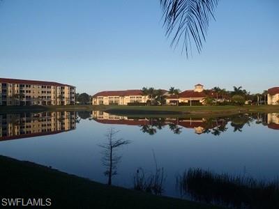 8490 Kingbird Loop, Unit 934 Estero, FL 33967 - Photo 14 of 26 a view of a lake with houses