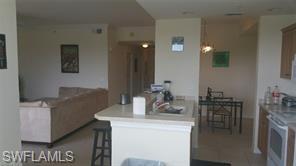 8490 Kingbird Loop, Unit 934 Estero, FL 33967 - Photo 17 of 26 a dining room with furniture and wooden floor
