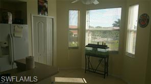8490 Kingbird Loop, Unit 934 Estero, FL 33967 - Photo 19 of 26 a bathroom with a granite countertop sink a toilet and shower