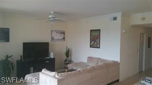 8490 Kingbird Loop, Unit 934 Estero, FL 33967 - Photo 20 of 26 a living room with furniture and a bathroom