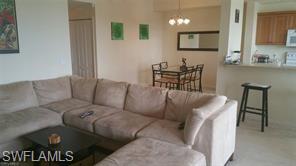 8490 Kingbird Loop, Unit 934 Estero, FL 33967 - Photo 21 of 26 a living room with furniture and a flat screen tv