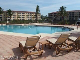8490 Kingbird Loop, Unit 934 Estero, FL 33967 - Photo 4 of 26 a view of a lake with outdoor seating
