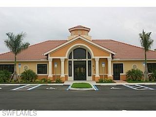 8490 Kingbird Loop, Unit 934 Estero, FL 33967 - Photo 9 of 26 a view of a house with a yard and potted plants
