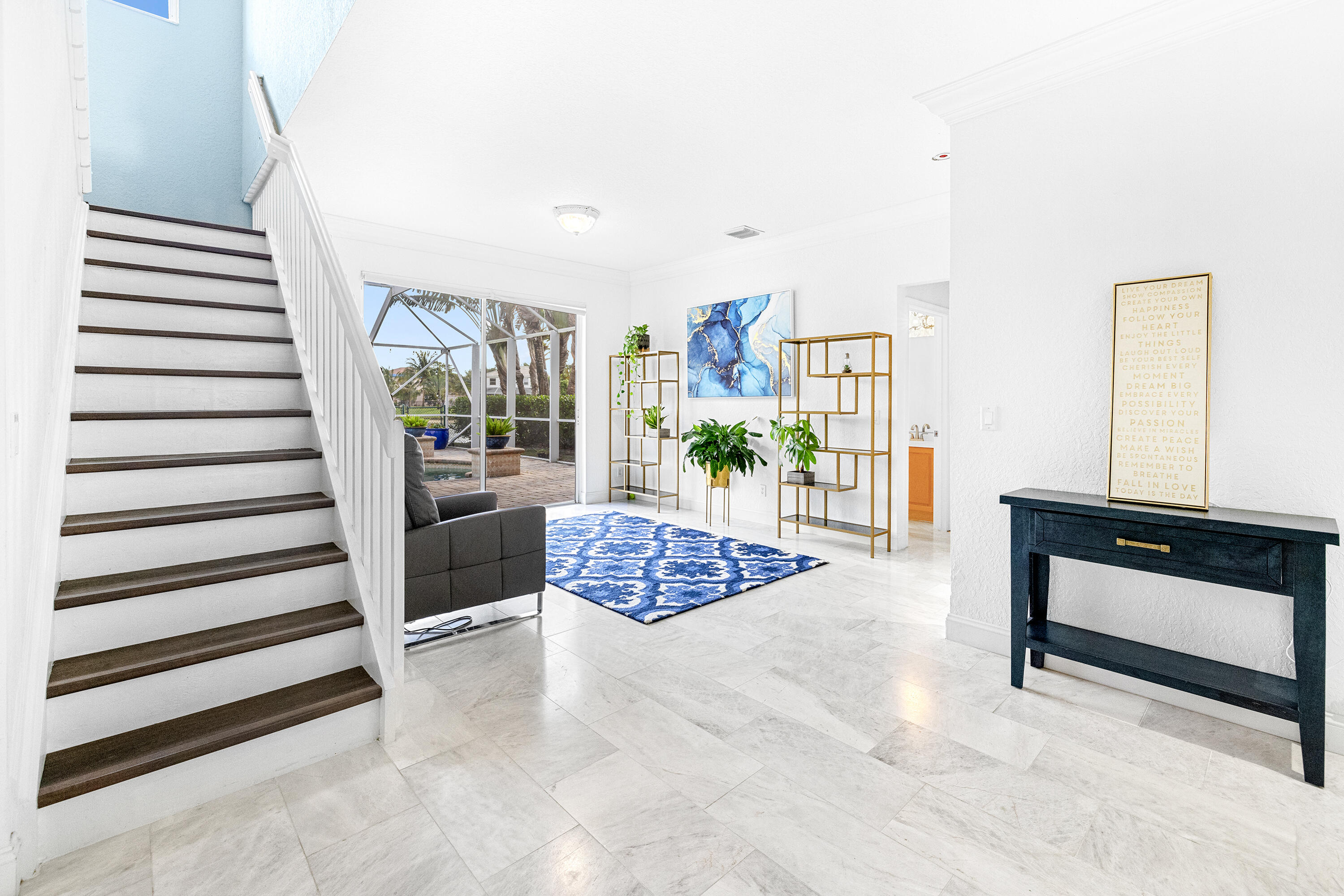 6575 Spring Meadow Drive Greenacres, FL 33413 - Photo 3 of 54 a view of entryway and hall