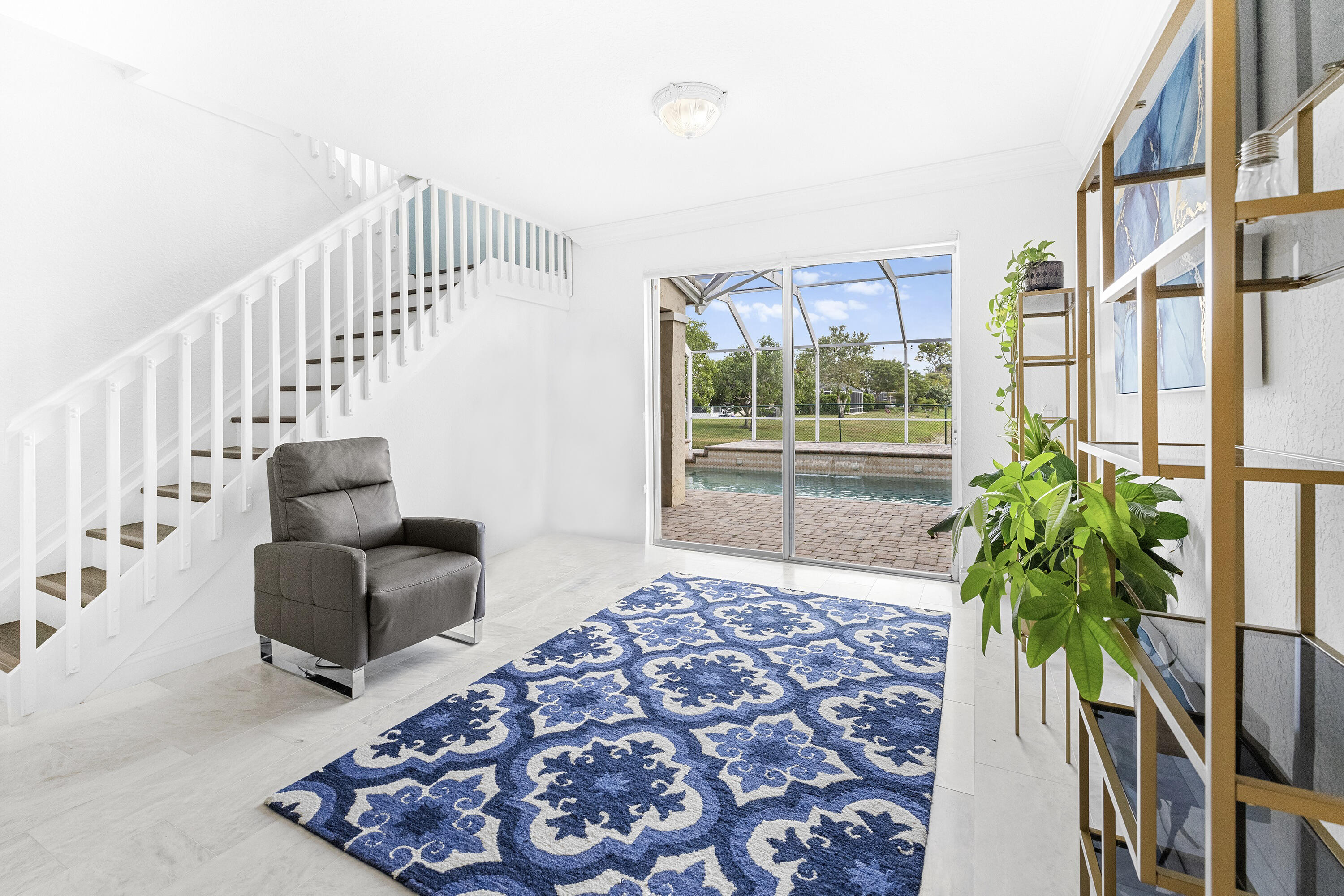 6575 Spring Meadow Drive Greenacres, FL 33413 - Photo 4 of 54 a living room with furniture and a potted plant