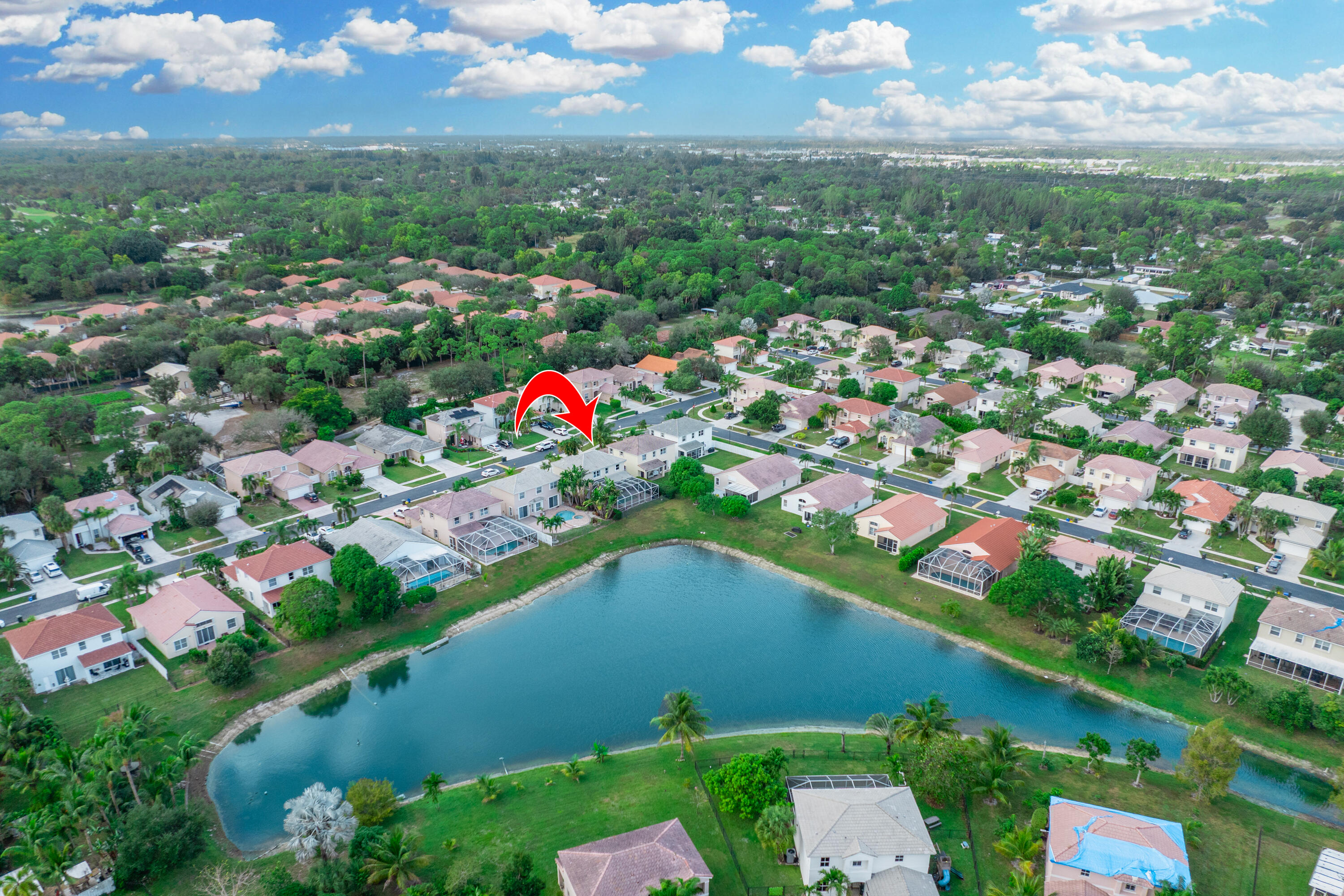 6575 Spring Meadow Drive Greenacres, FL 33413 - Photo 50 of 54 an aerial view of a city