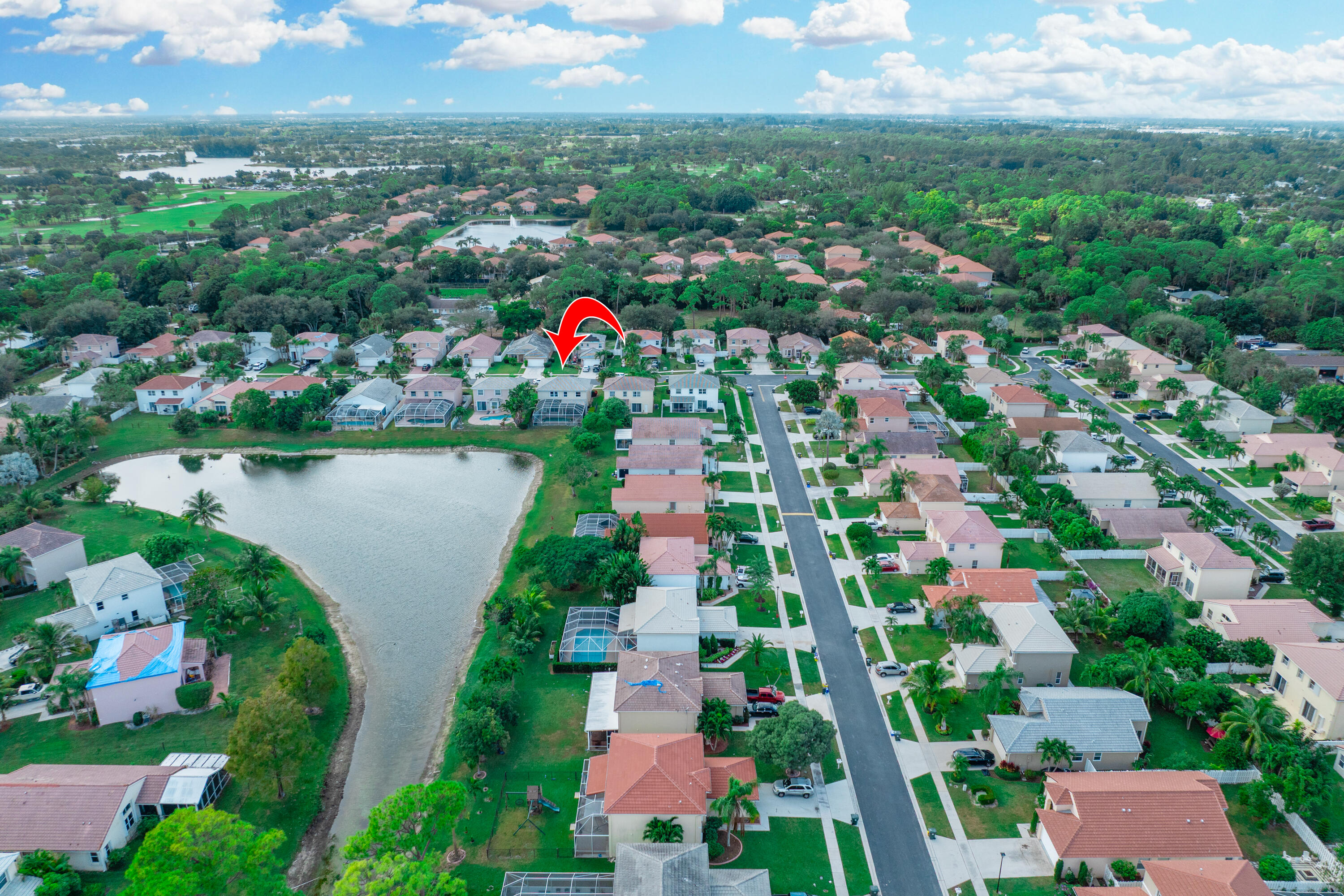 6575 Spring Meadow Drive Greenacres, FL 33413 - Photo 51 of 54 an aerial view of residential house with outdoor space and lake view in back