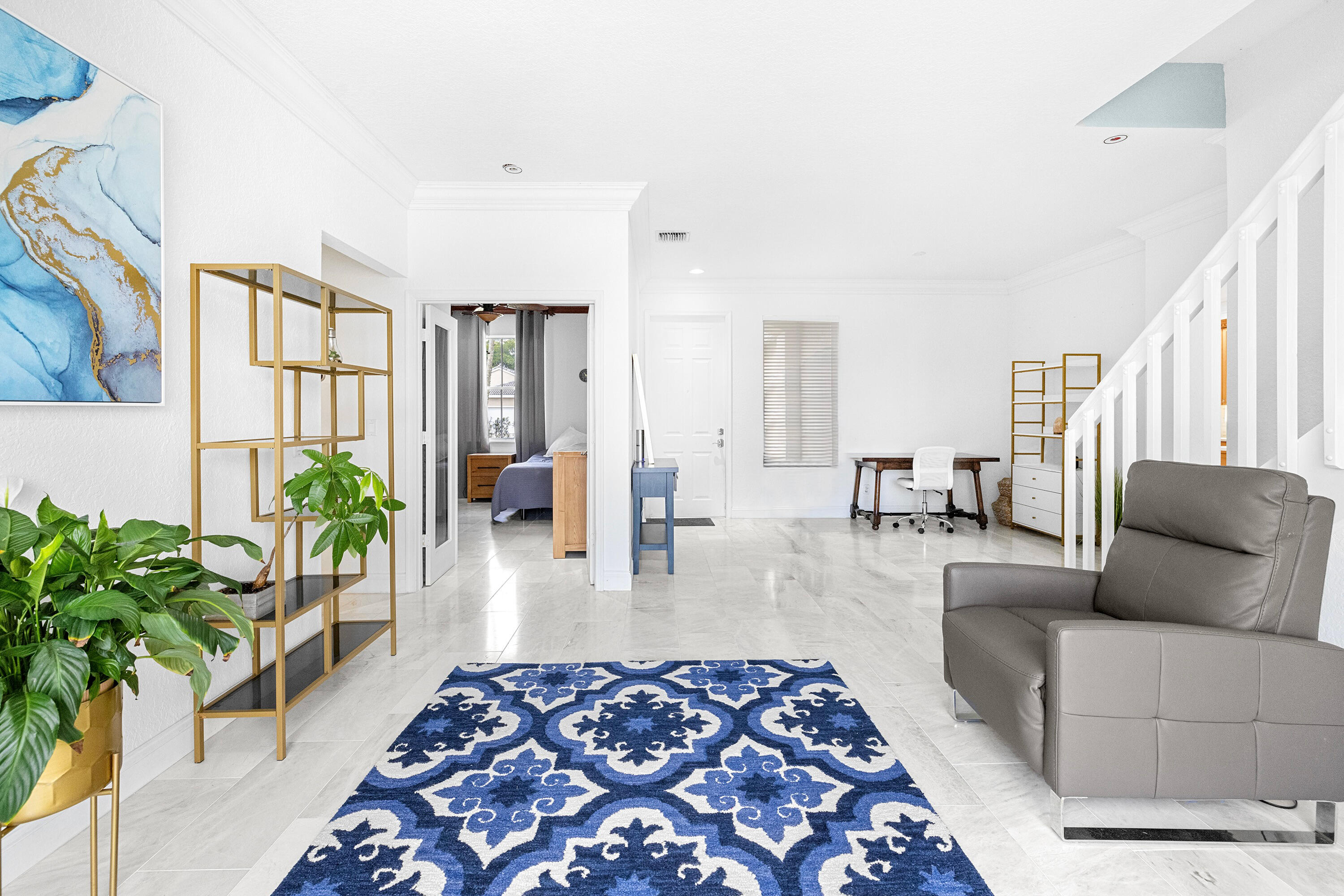 6575 Spring Meadow Drive Greenacres, FL 33413 - Photo 6 of 54 a living room with furniture and a rug