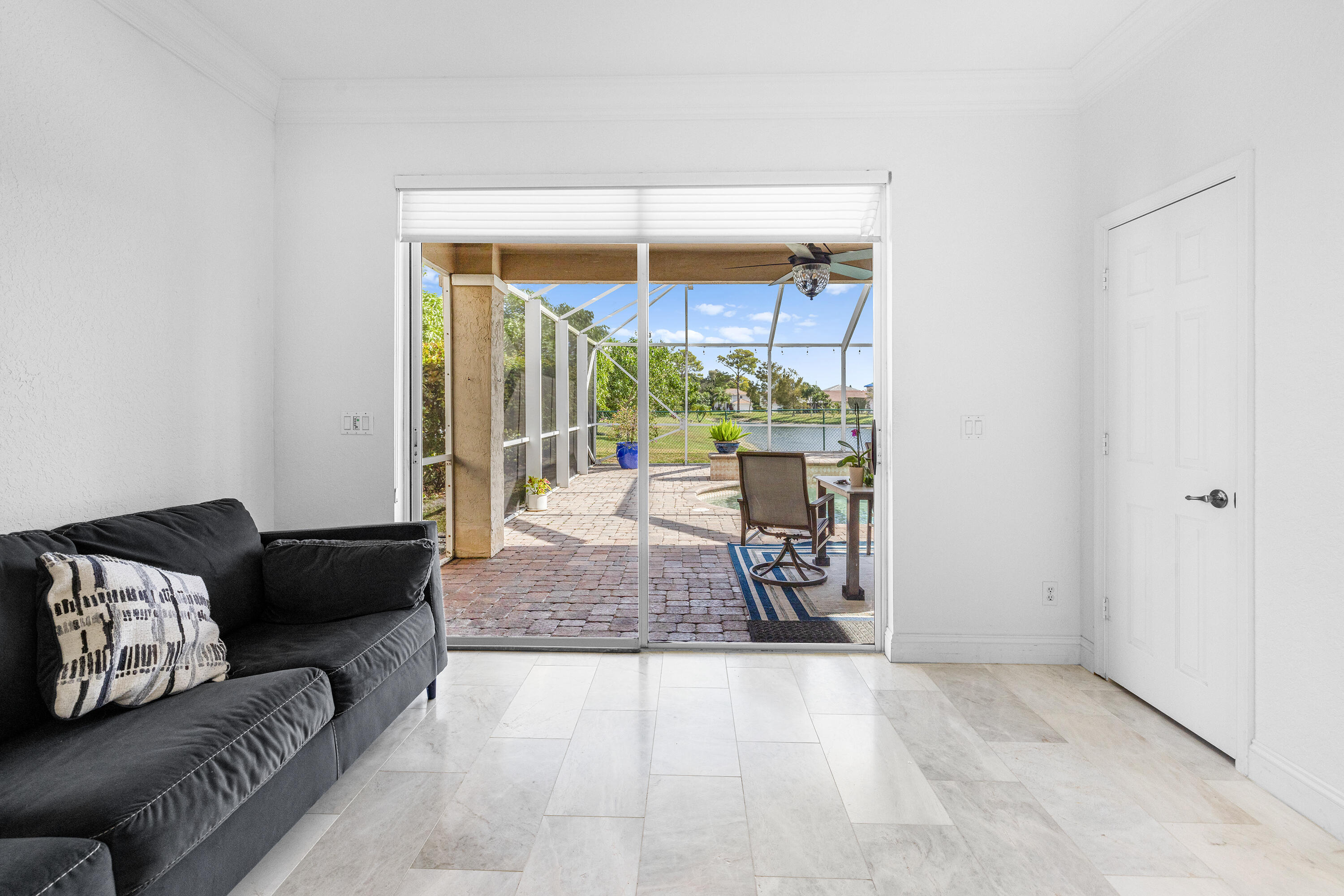 6575 Spring Meadow Drive Greenacres, FL 33413 - Photo 8 of 54 a living room with furniture and a window