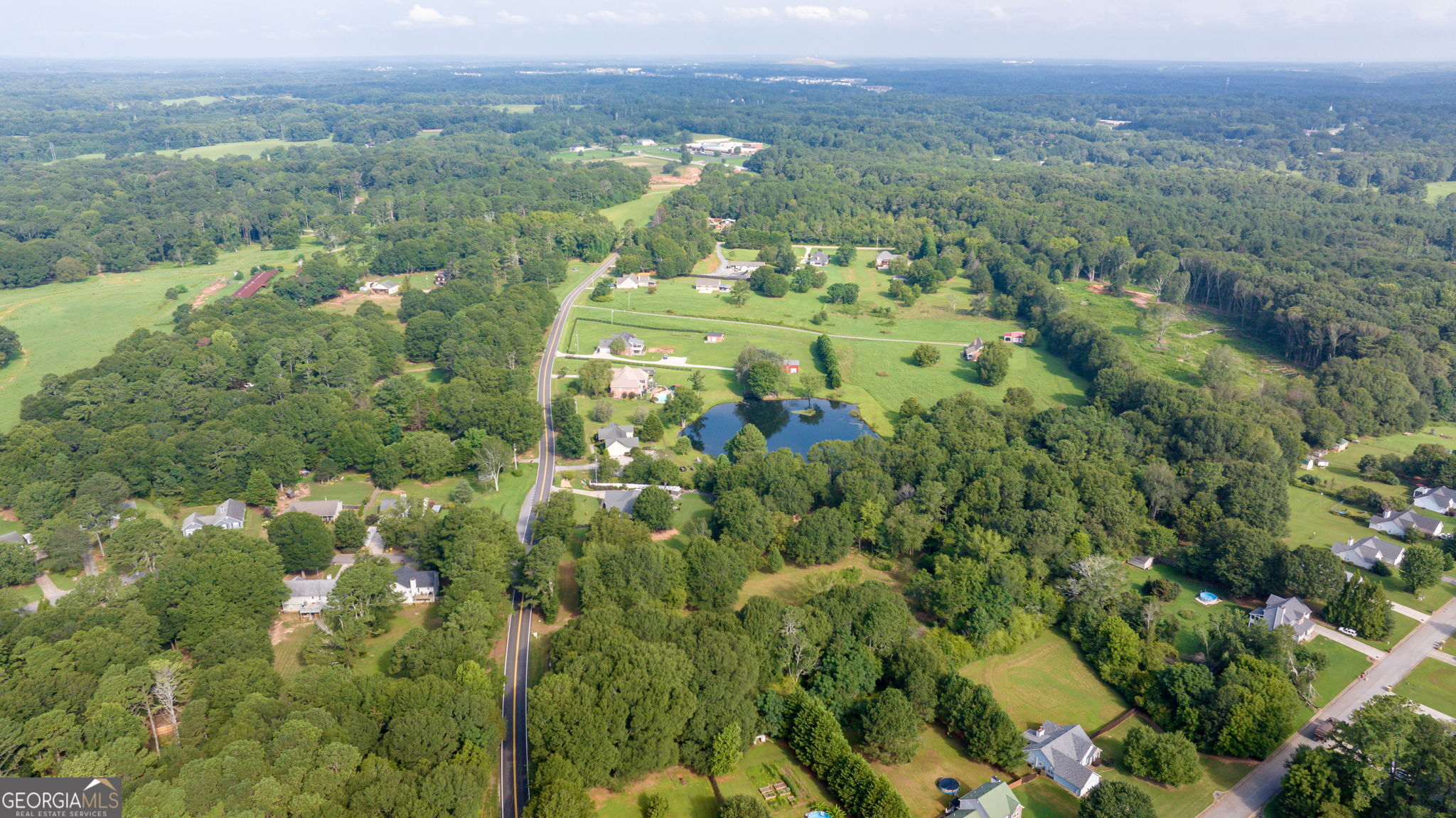 0 McElhannon Road Southeast Bethlehem, GA 30620 - Photo 14 of 23 a view of a city with lush green forest