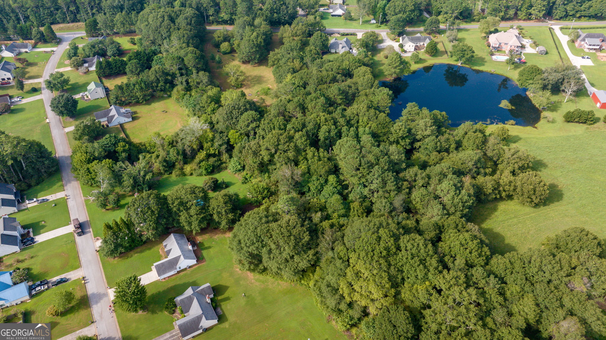 0 McElhannon Road Southeast Bethlehem, GA 30620 - Photo 20 of 23 an aerial view of residential house with outdoor space and trees all around