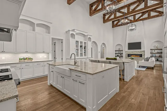 a kitchen with cabinets a sink and appliances