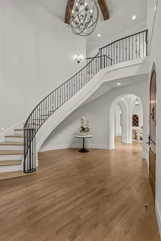 a view of entryway and hall with wooden floor