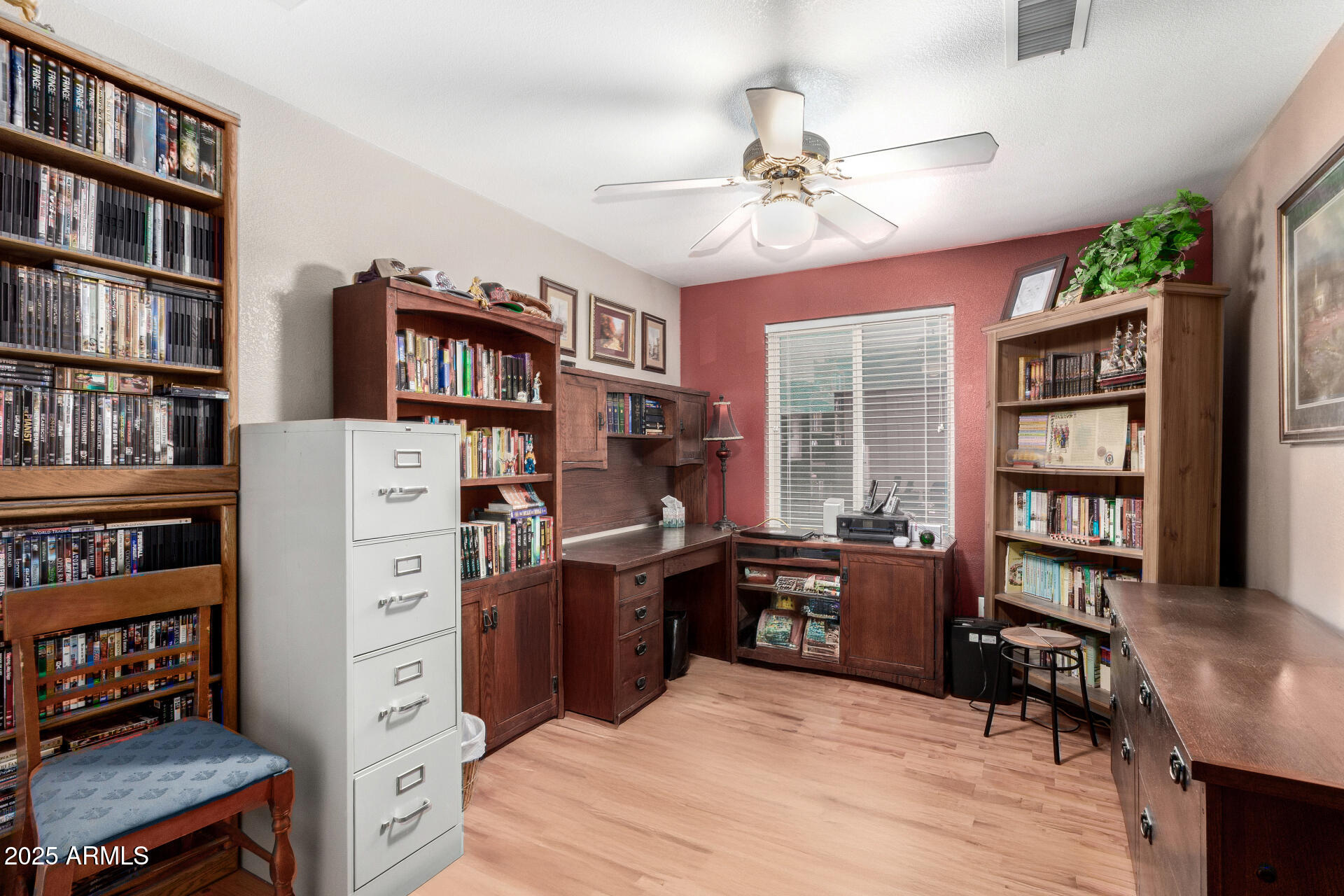 538 West Silver Creek Road Gilbert, AZ 85233 - Photo 28 of 41 a view of a workspace with bookshelf and a window