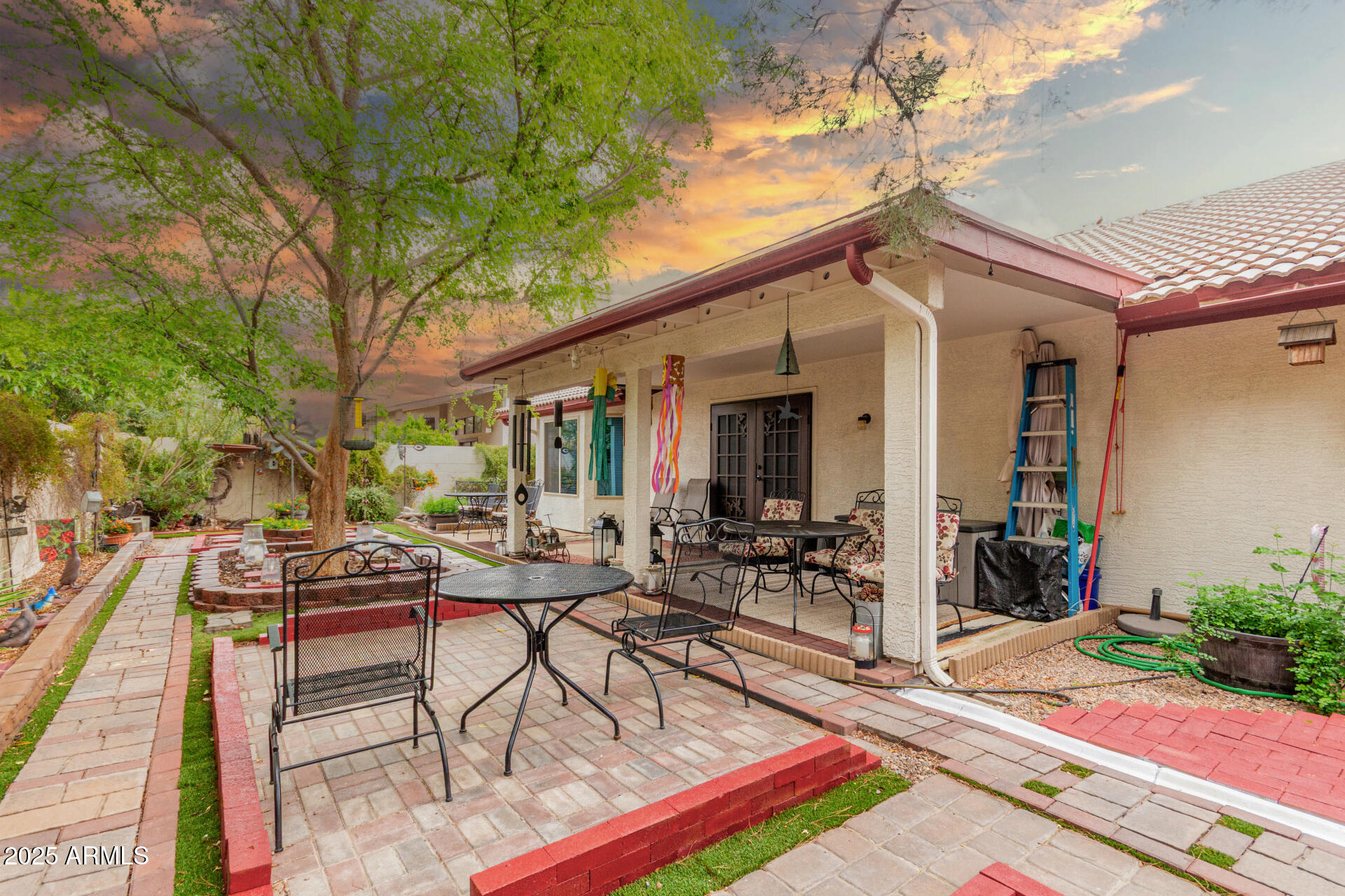 538 West Silver Creek Road Gilbert, AZ 85233 - Photo 41 of 41 a view of a patio with table and chairs potted plants and floor to ceiling window