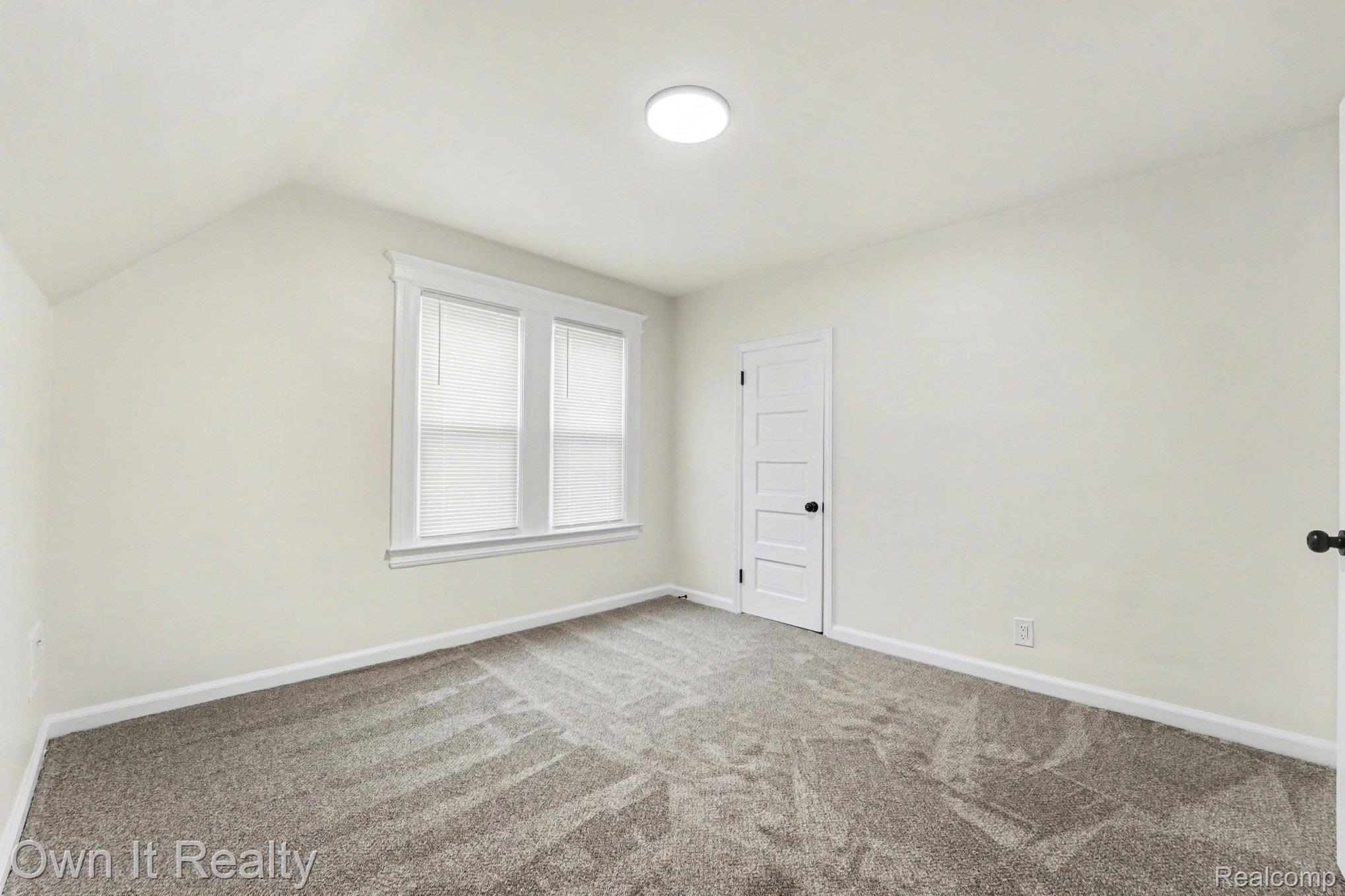 168 Kerby Road Grosse Pointe, MI 48236 - Photo 18 of 36 Additional living space with carpet flooring and lofted ceiling