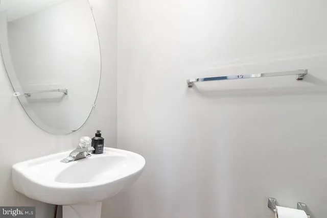 a bathroom with a sink and mirror
