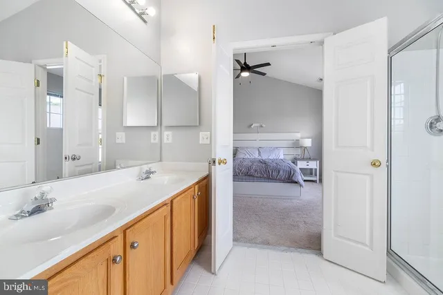 a bathroom with a tub sink and mirror