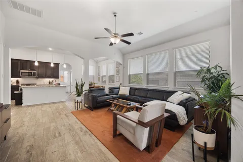 a living room with furniture fireplace and flat screen tv