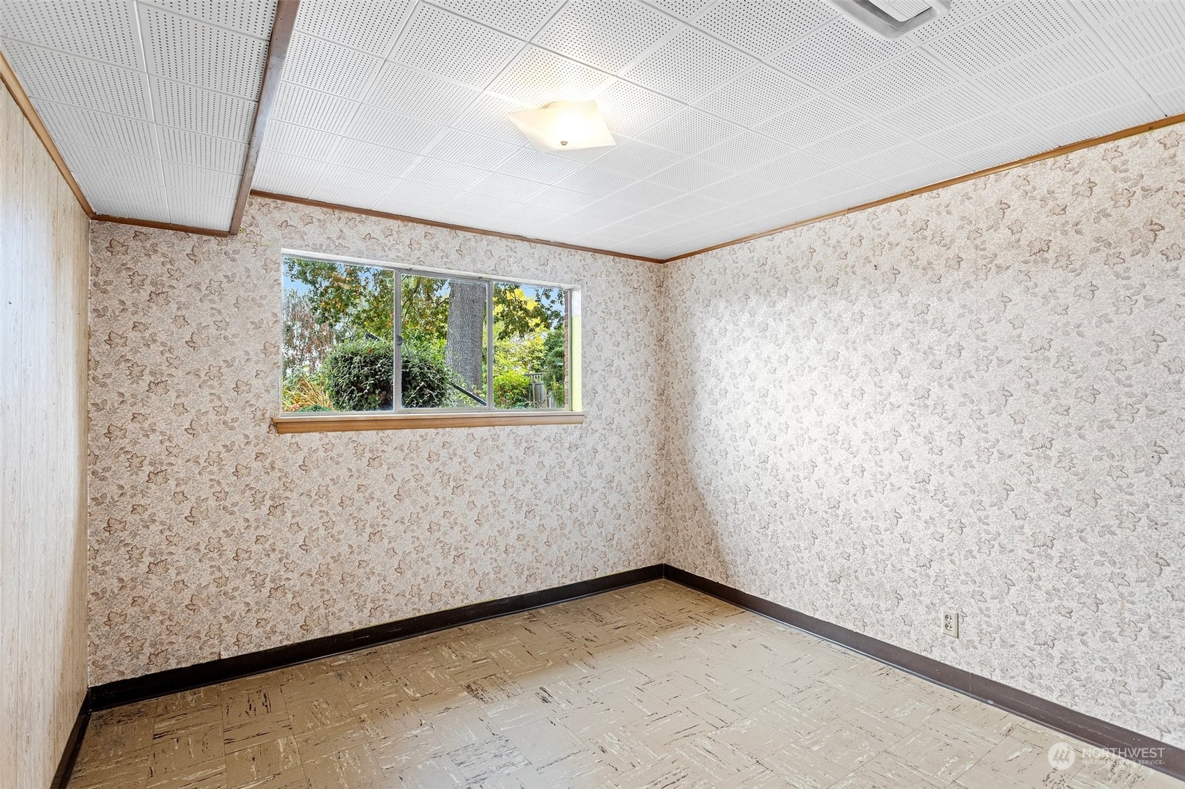 5709 South Upland Road Seattle, WA 98118 - Photo 24 of 37 a view of an empty room with a window