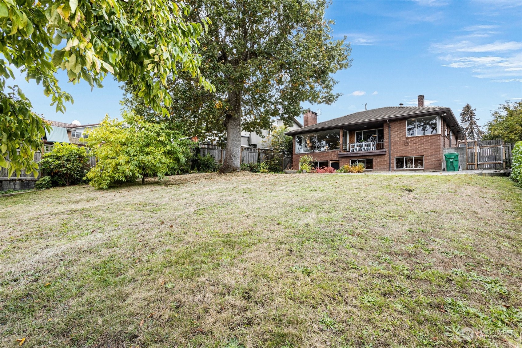 5709 South Upland Road Seattle, WA 98118 - Photo 29 of 37 a front view of a house with a yard