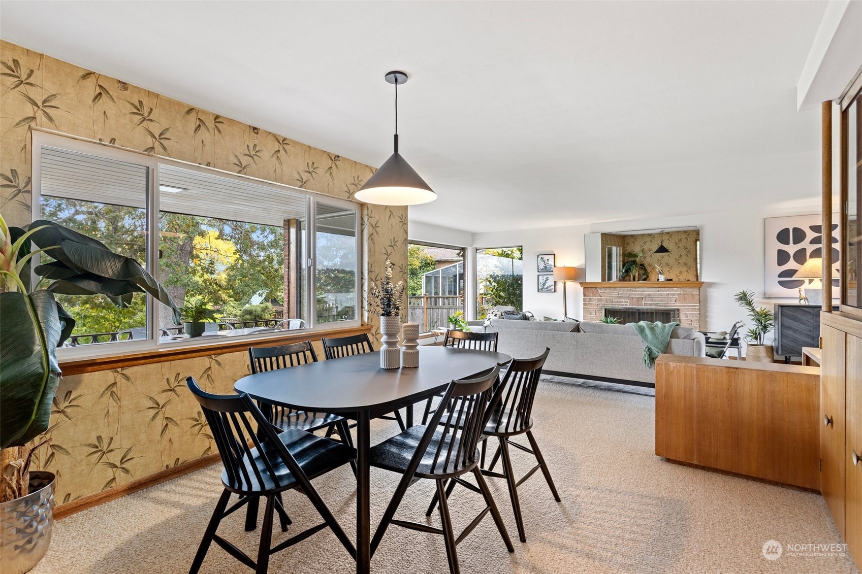 5709 South Upland Road Seattle, WA 98118 - Photo 9 of 37 a view of a dining room with furniture window and wooden floor