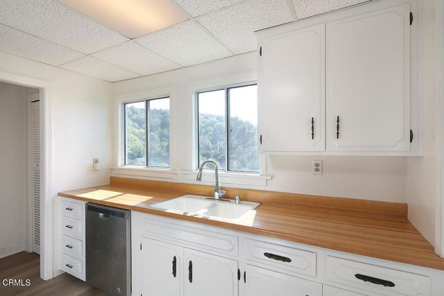 a kitchen with sink and window