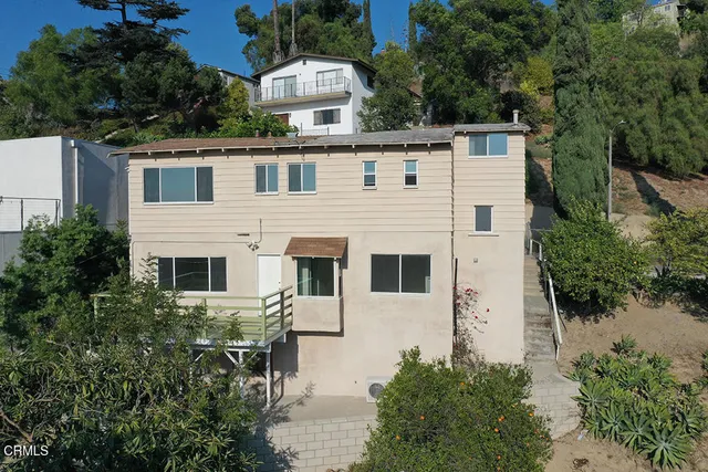 an aerial view of residential house and outdoor space