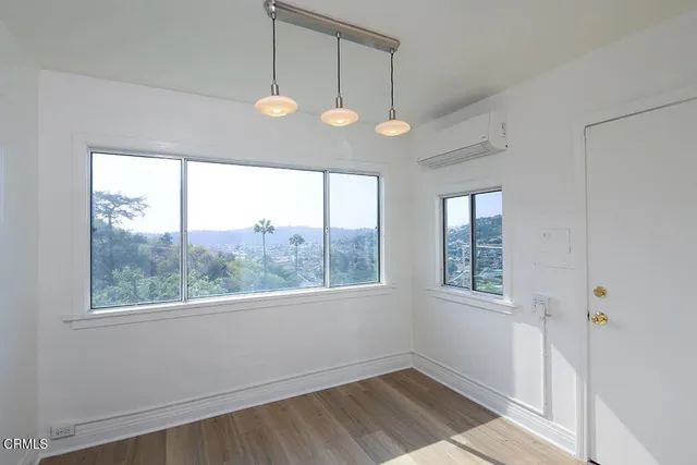 a view of an empty room with a window